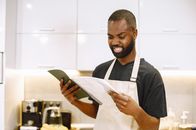 Troubled Man looking at a Notebook