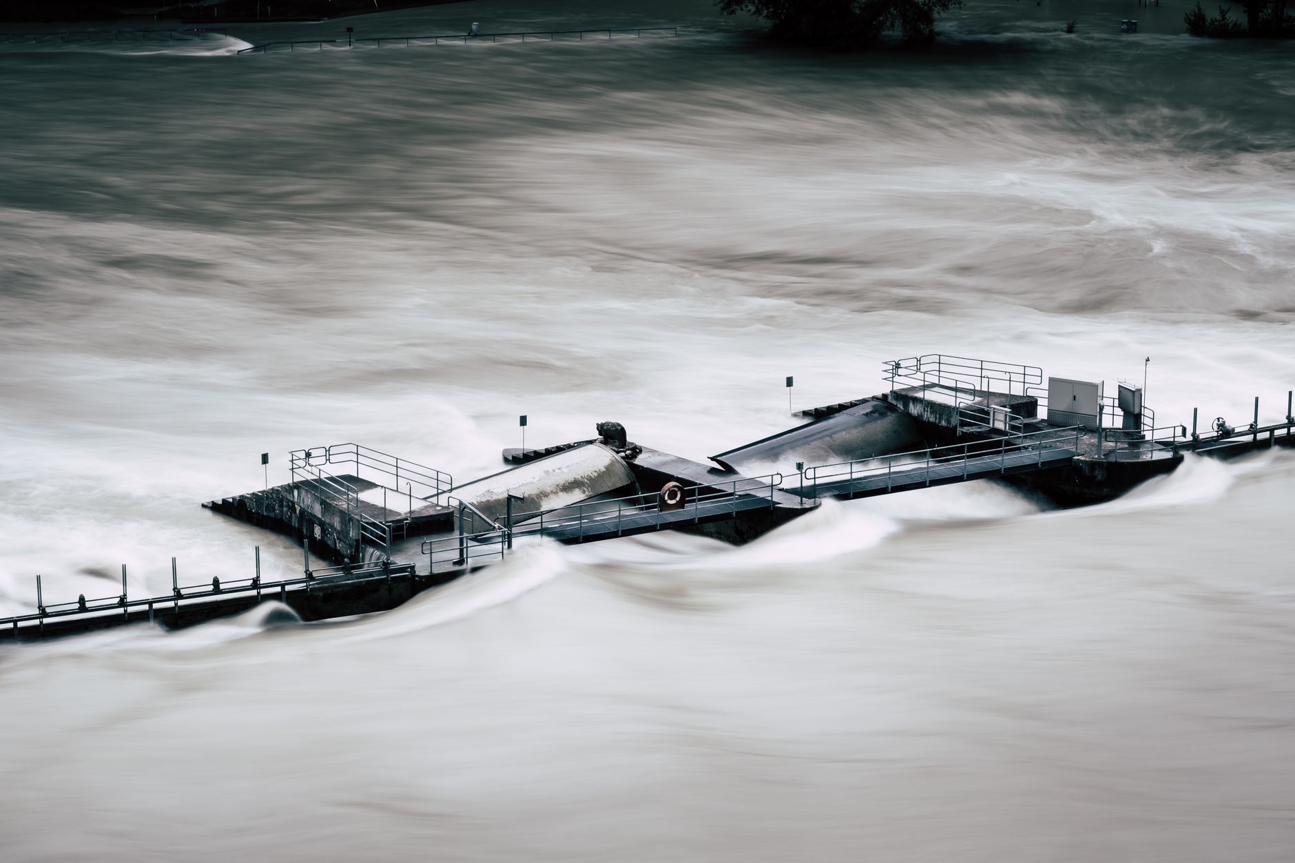 An aerial view of a structure overwhelmed by a river flood in Bern, Switzerland.