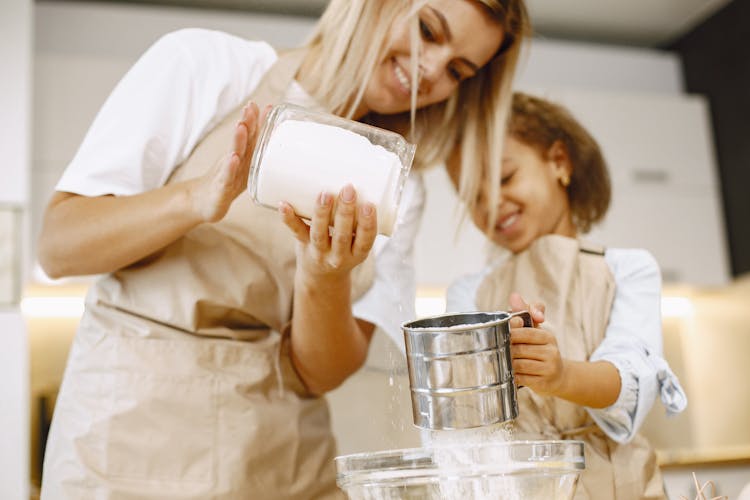 Mother And Daughter Cooking Together