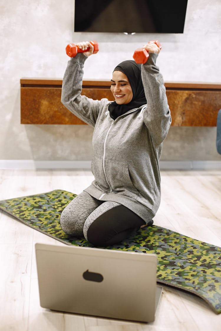 Woman In Hijab During Workout With Dumbbells