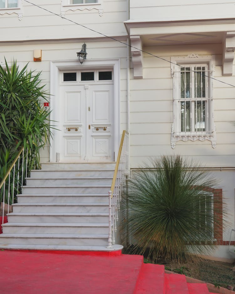 Steps And The Front Door Of An Apartment Building