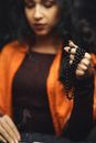 Woman Closed Eyes Holding a Prayer Beads