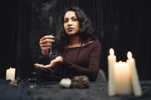 A Woman Sitting with a Crystal