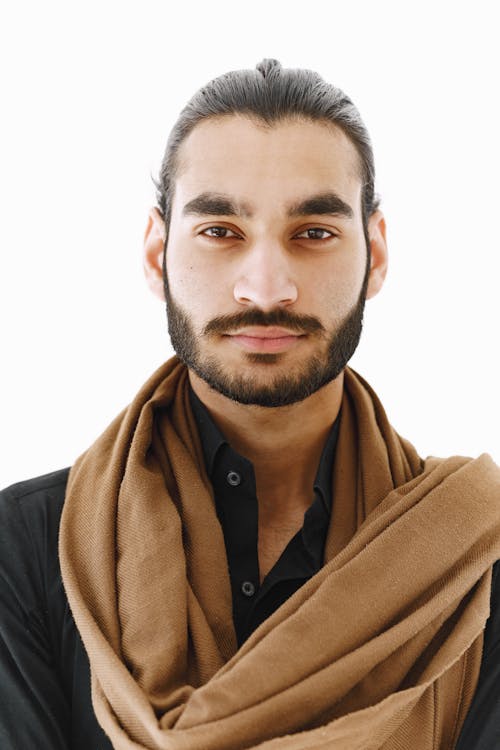 Bearded Man in Brown Scarf Looking at The Camera