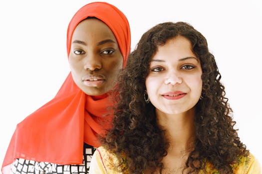 Portrait of two diverse women in traditional attire, highlighting cultural beauty and diversity.