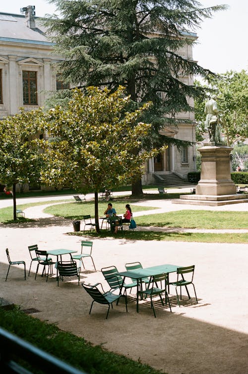 Front Yard of a Classical Building with a Patio of a Cafe 
