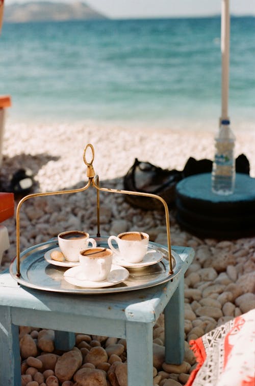 Coffee in a Ceramic Cups on the Table Beside the Beach