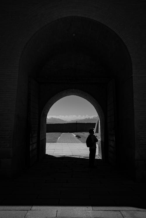 Free Grayscale Photo of a Man inside the Tunnel Stock Photo