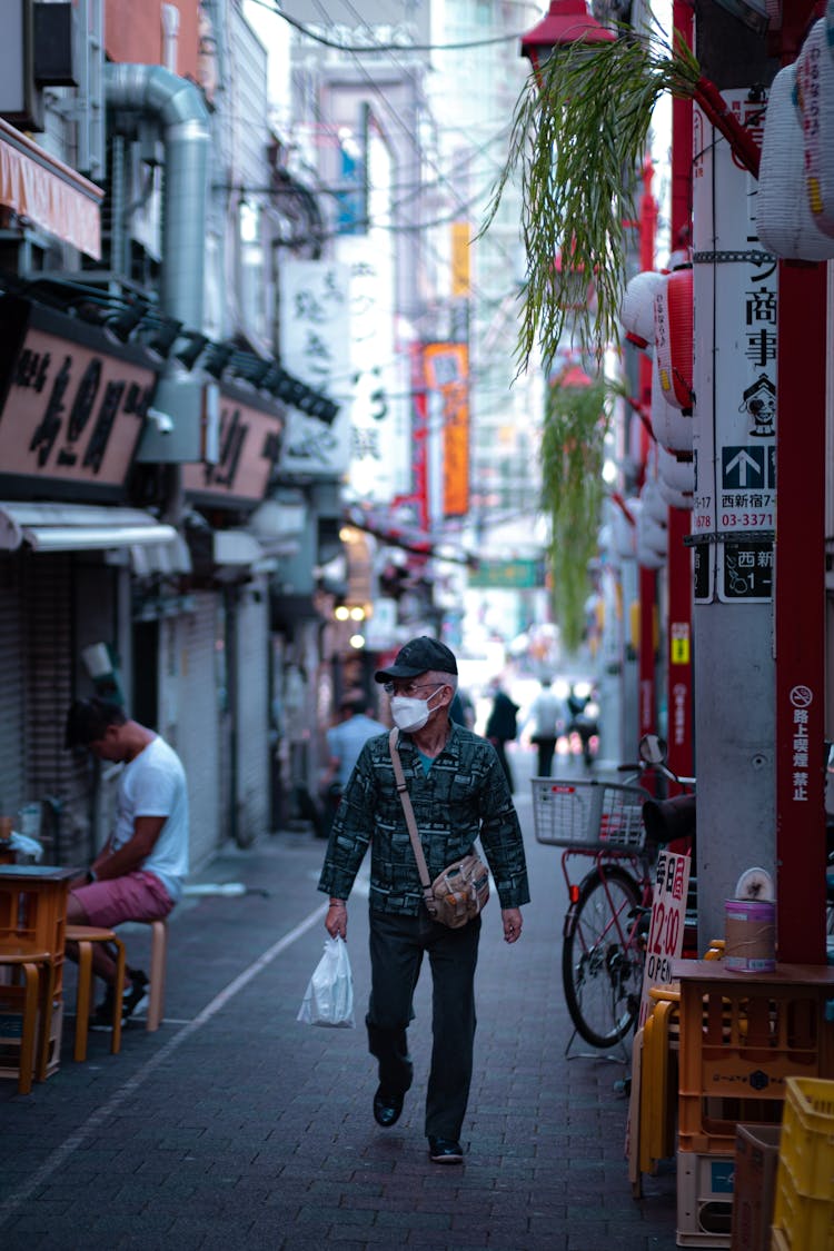 Elderly Man Walking On The Street