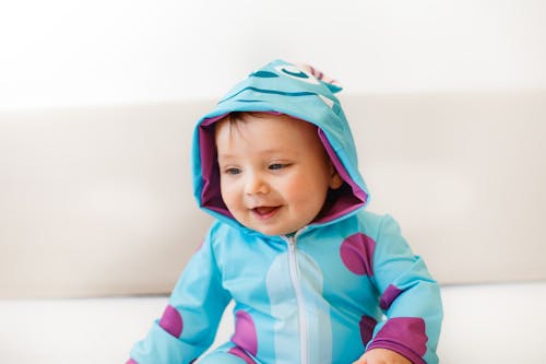 Free Close-Up Shot of a Cute Baby in Costume Smiling Stock Photo