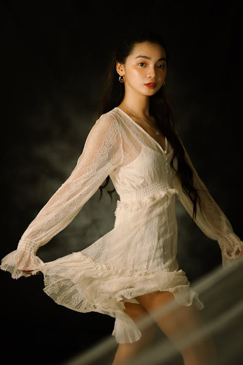 Woman in White Long Sleeve Dress