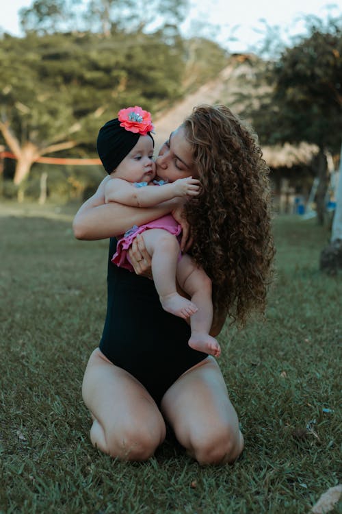 Mother Kissing Her Cute Baby