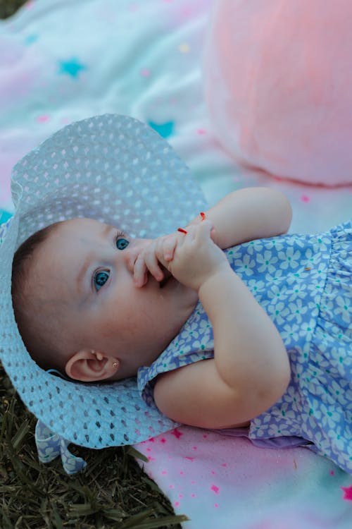 Free Baby in White and Blue Floral Dress Stock Photo