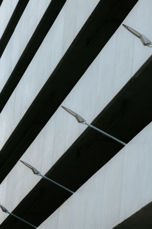 Free Close-up view of a modern architecture featuring concrete structural beams. Stock Photo