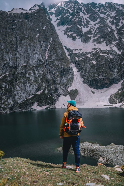 A Man Standing in Mountains