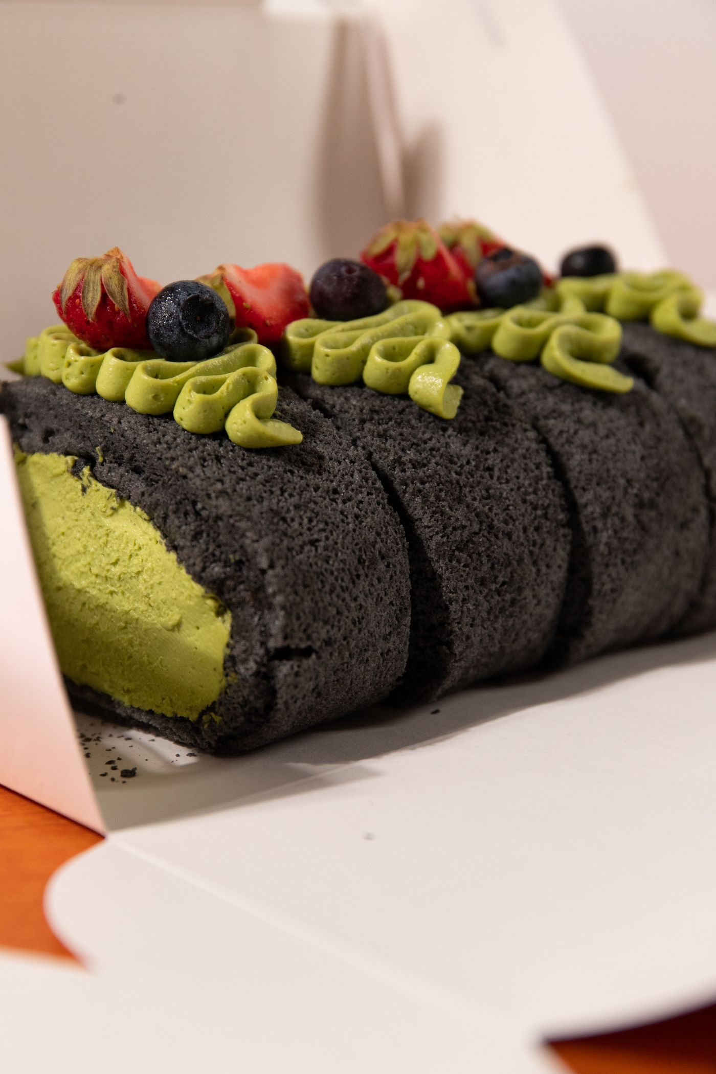 A matcha swiss roll, sliced