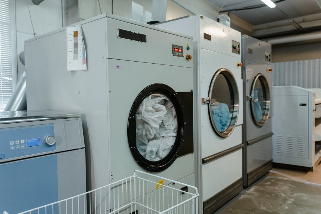 Free Washing Machines in a Laundry Shop Stock Photo