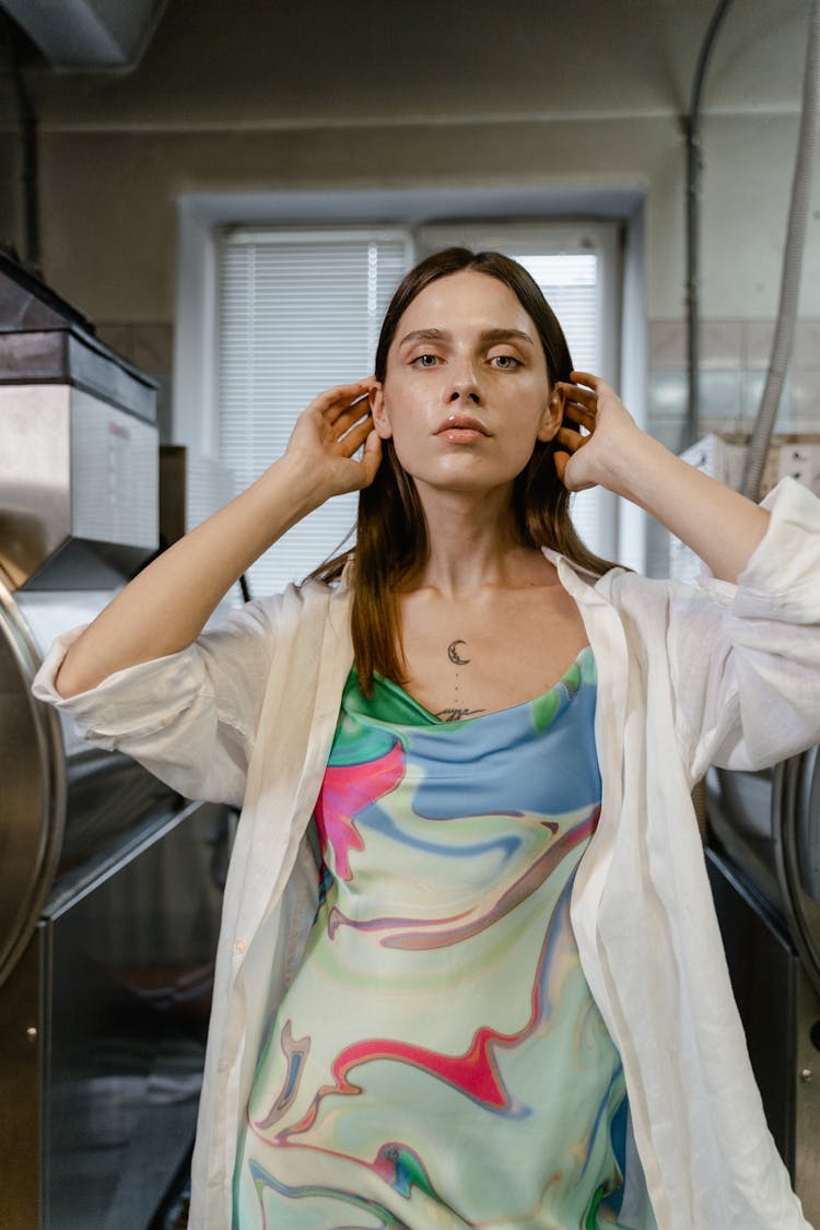 Young Woman Wearing A Colorful Patterned Dress And A White Shirt 