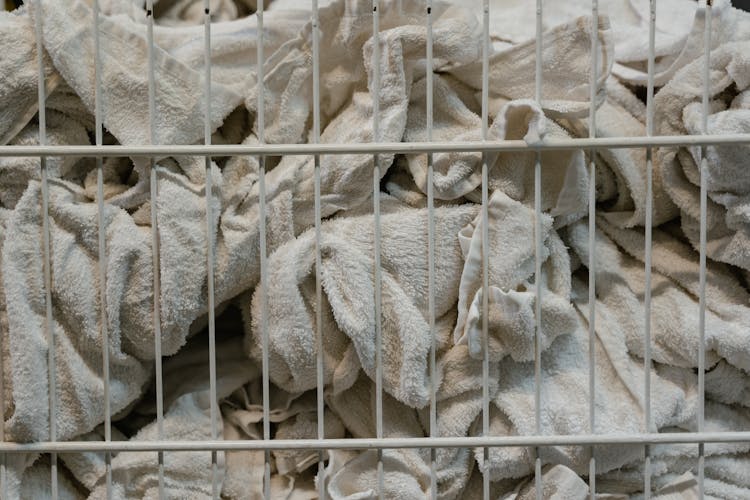 White Towels Inside Metal Basket