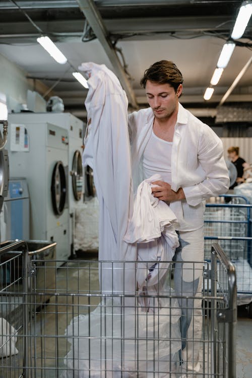Free A Man Doing Laundry Stock Photo