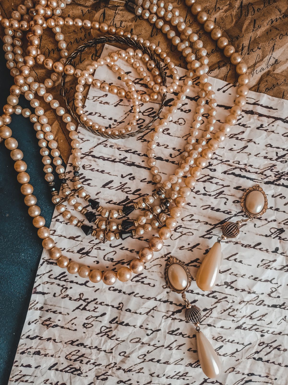 Pearl jewelry arranged on a tabletop