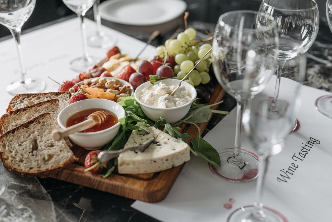 Charcuterie board with cheese grapes and wine perfect for a San Diego winery visit