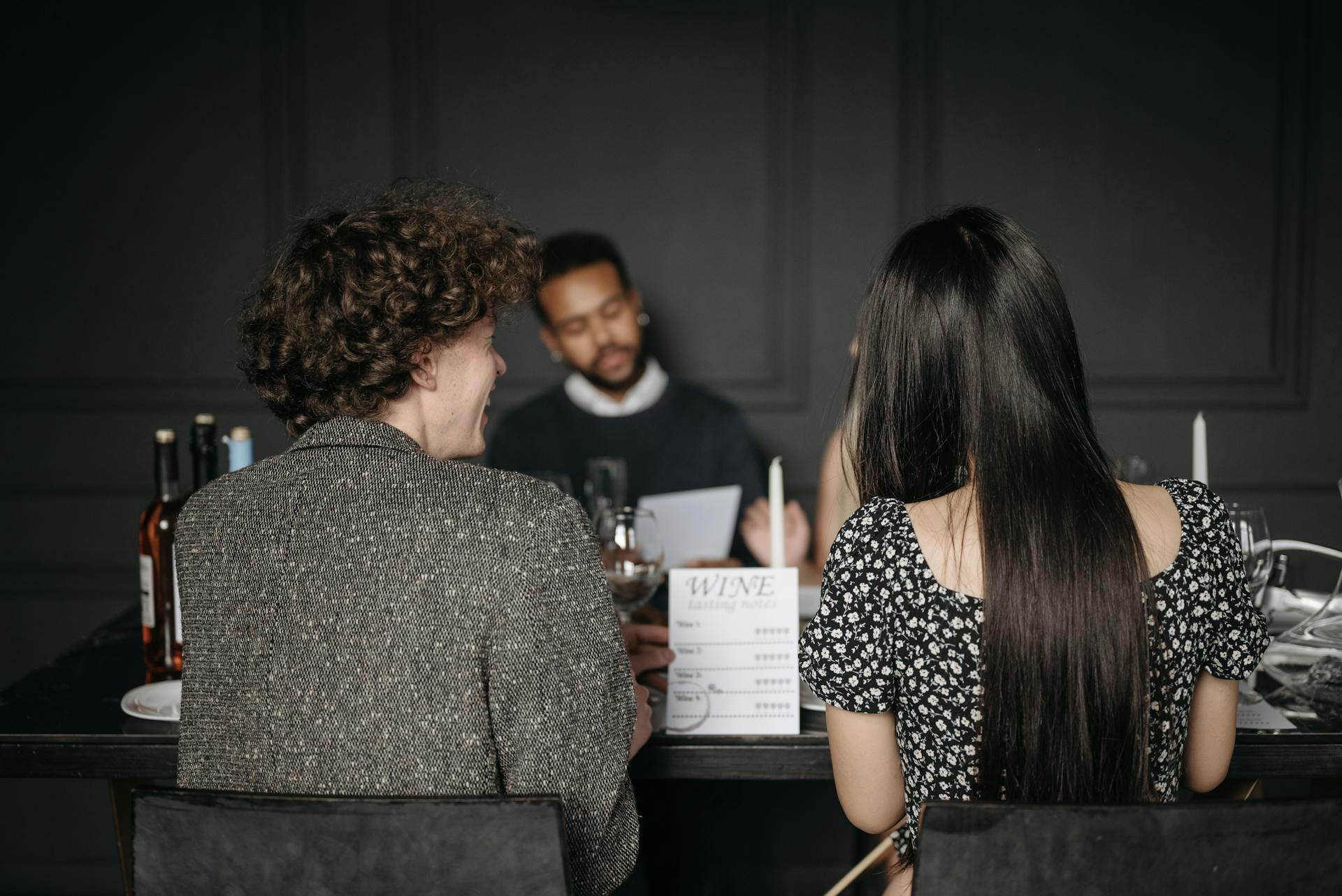 Back View of a Man and Woman Looking the Wine Menu