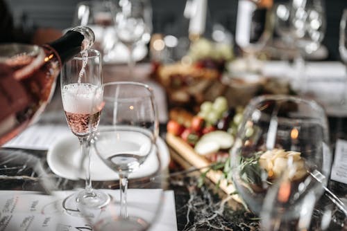 Glass and Plates on a Table During Dinner 