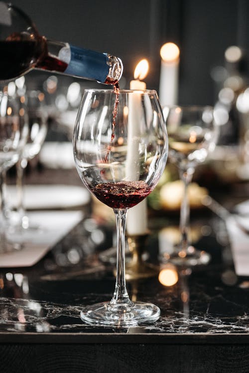 Close-Up Shot of a Red Wine on a Dining Table