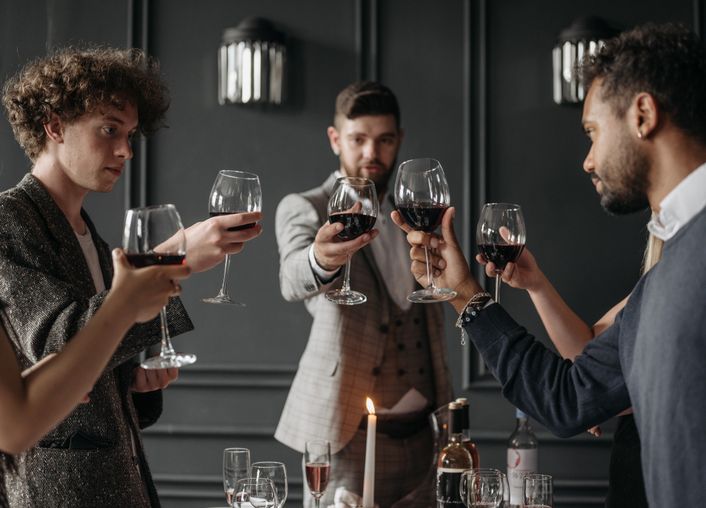 diverse group of LGBTQ+ individuals enjoying coffee together in a modern café