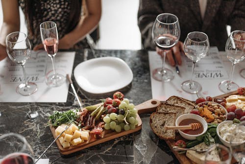 Glass and Plates on a Table During Dinner 