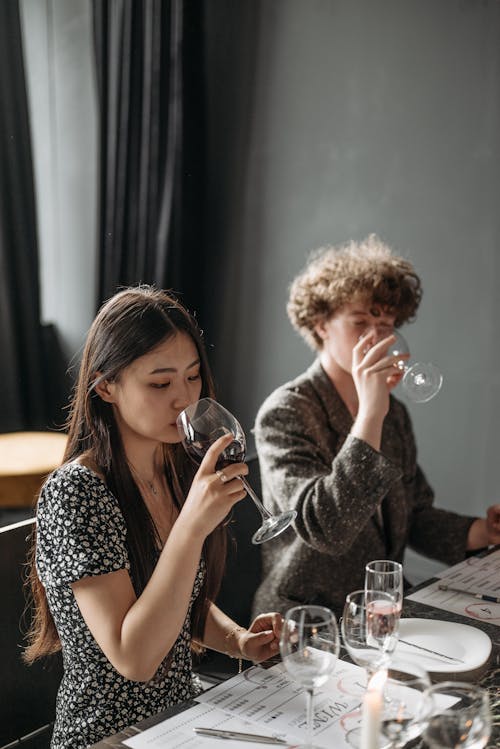 Free A Man and Woman Drinking Wine Stock Photo