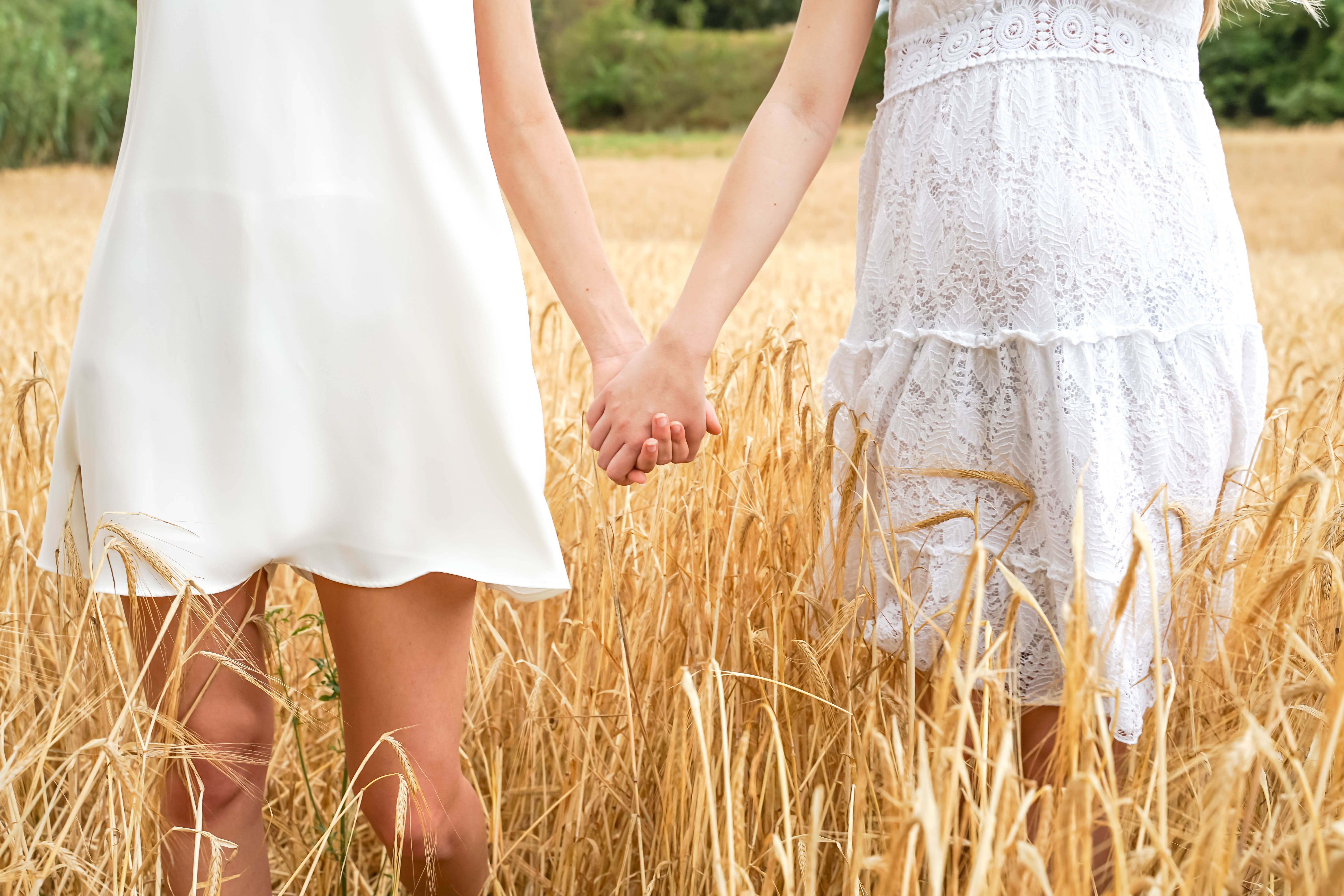 Women in White Dress Standing on the Grass Field · Free Stock Photo