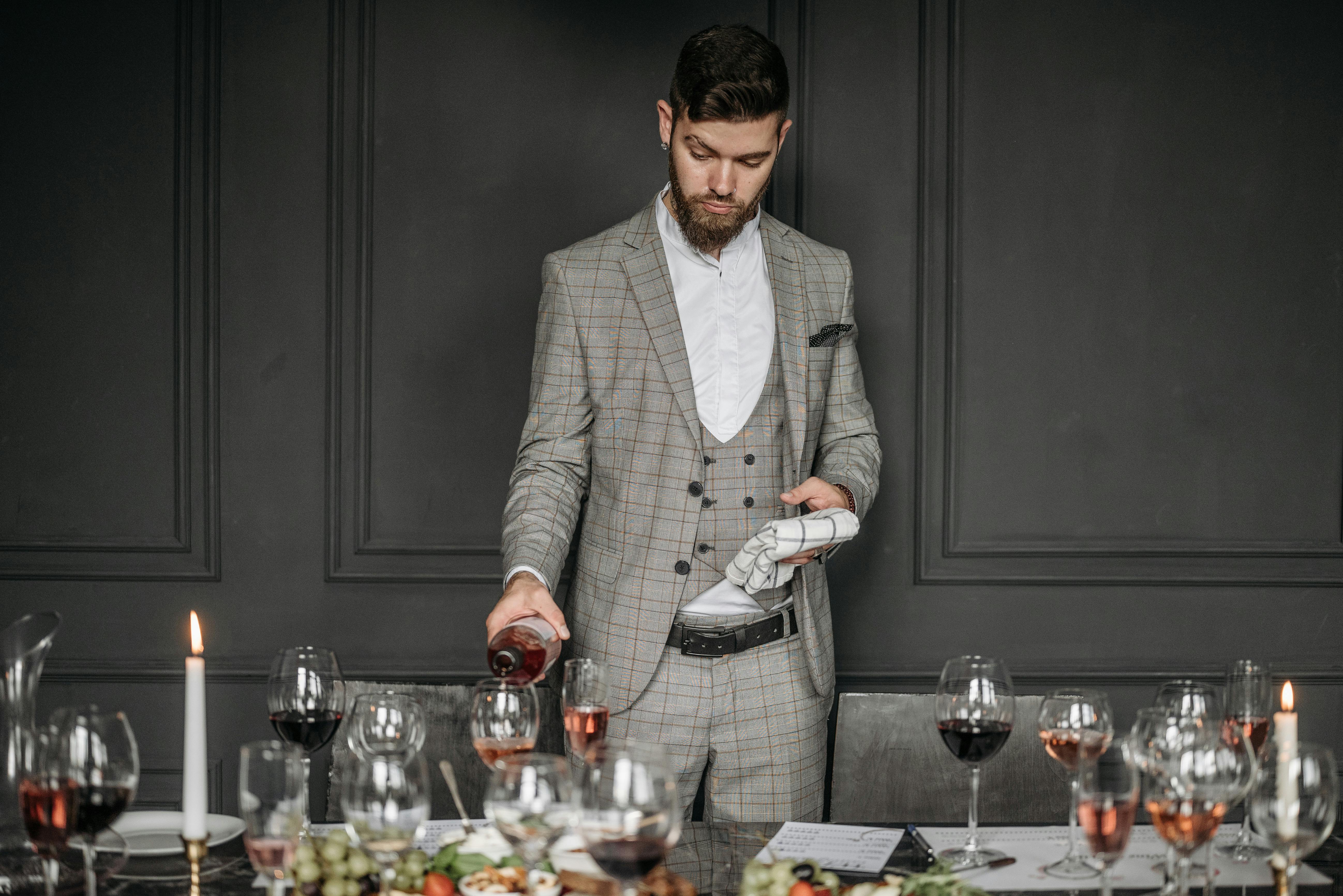 wine tasting professional sommelier pouring amber wine