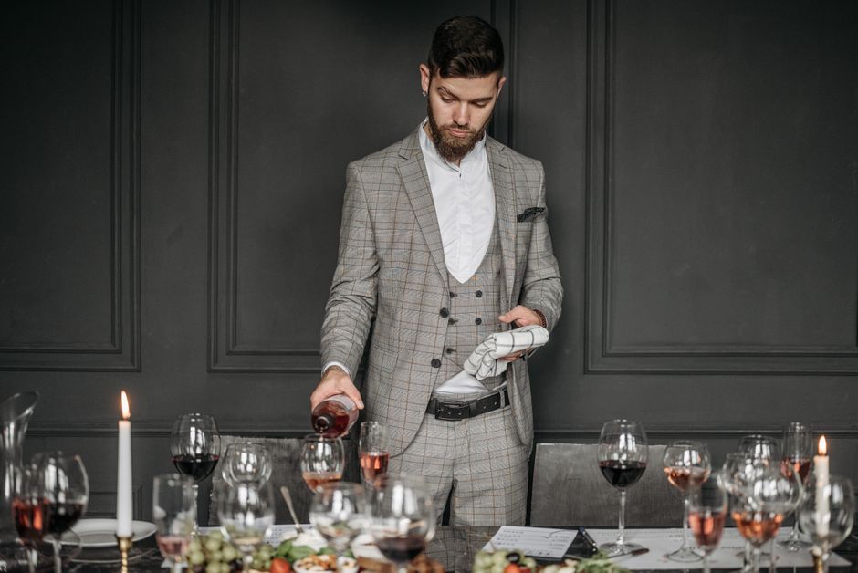 wine tasting professional sommelier pouring amber wine