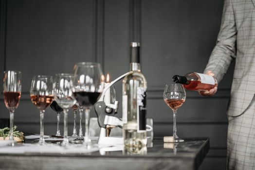 sommelier pouring wine restaurant