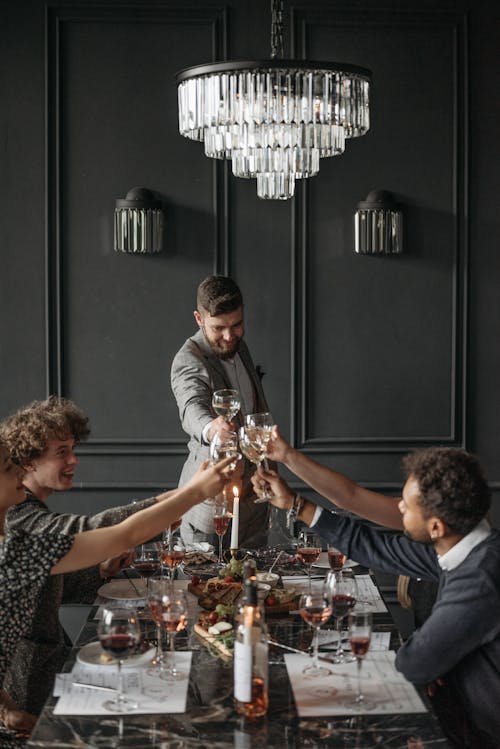 Free People Toasting their Wine Glasses Stock Photo