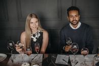 Man and Woman Holding Wine Glasses