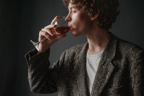 Free Man Drinking Wine with his Eyes Closed Stock Photo