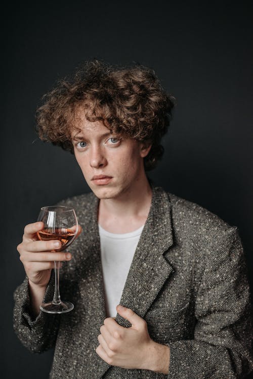 Portrait of Elegant Man Drinking Red Wine 