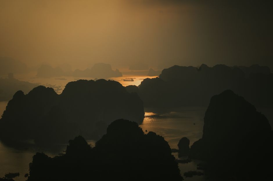 Sunset over Quang Ninh heritage landscape combining river, mountains, sea, and museum symbolism, reflective cultural travel mood, cinematic golden hour, ultra detailed, editorial photography style