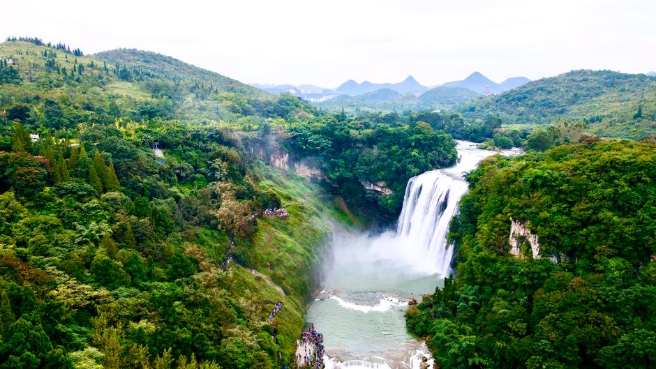 Huangguoshu Waterfall wide view with mist and rainbow