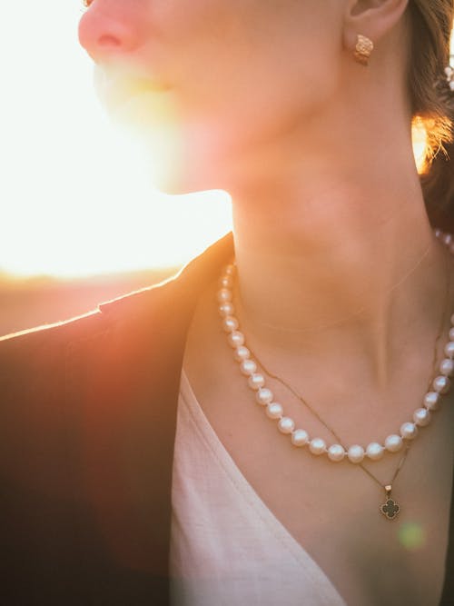 Free Close-Up Shot of a Person Wearing Pearl Necklace Stock Photo