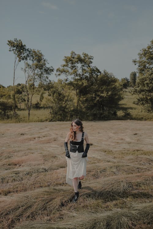 A Woman Walking on the Field