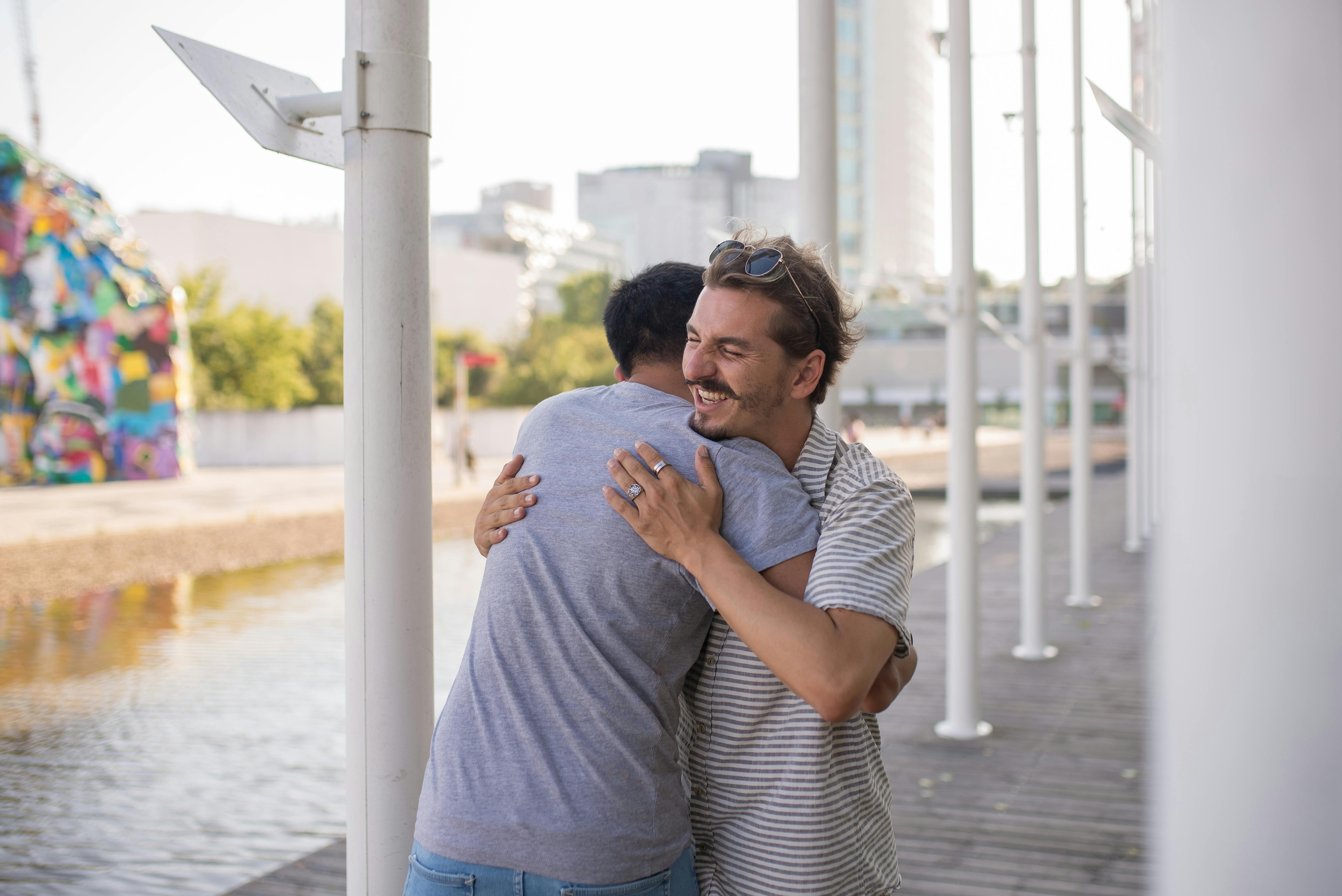 Two Men Standing Next to Each Other With Clenched Fists Free