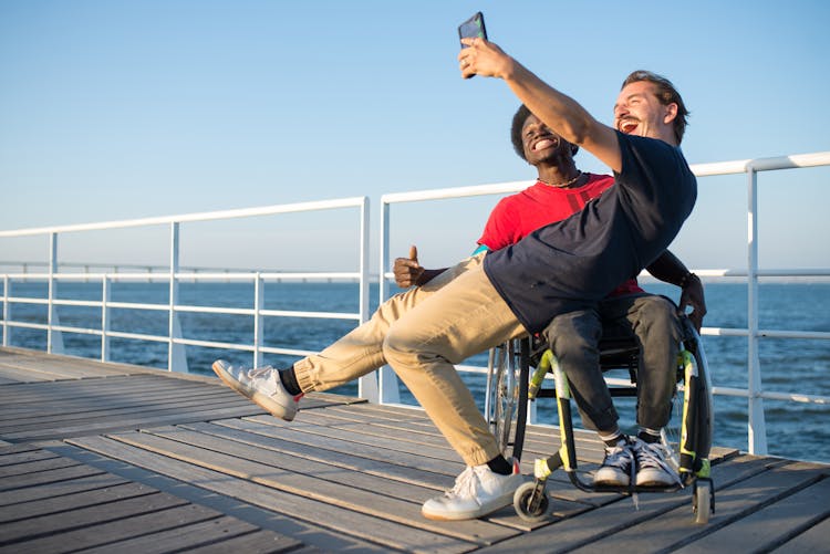 Man Taking Selfie With His Friend