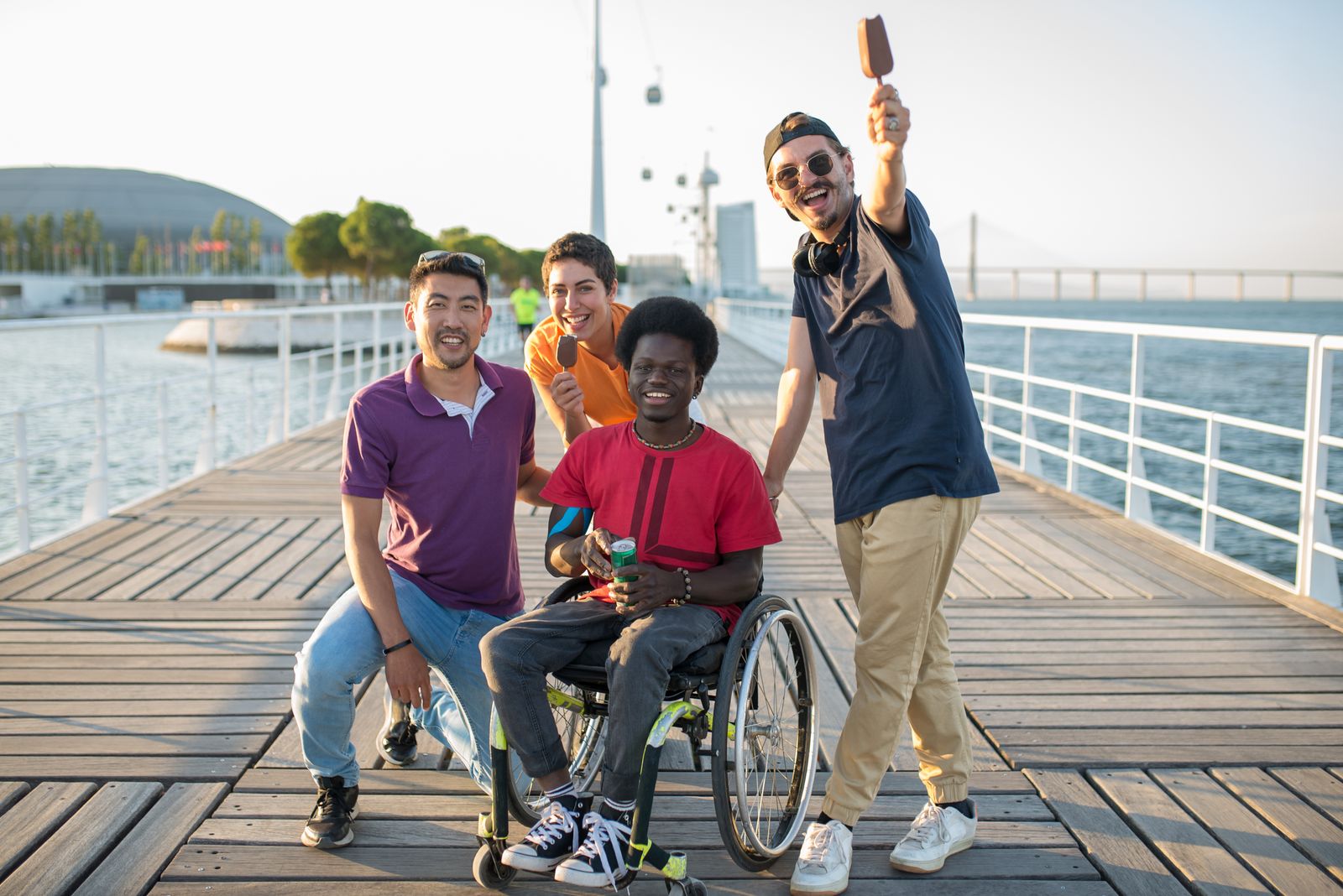Friends spending time together on a waterfront boardwalk