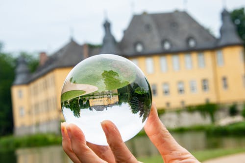 A Person Holding a Crystal Ball