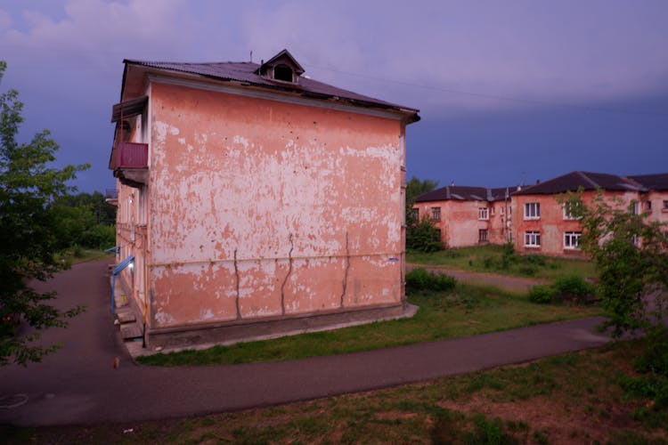 Street With Old House With Eroded Wall