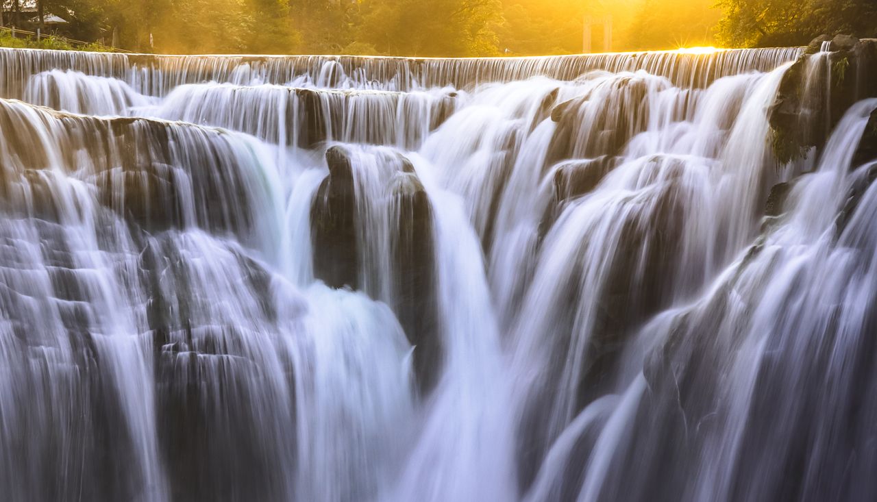 a mesmerizing view of shifen waterfall captured during golden hour emp